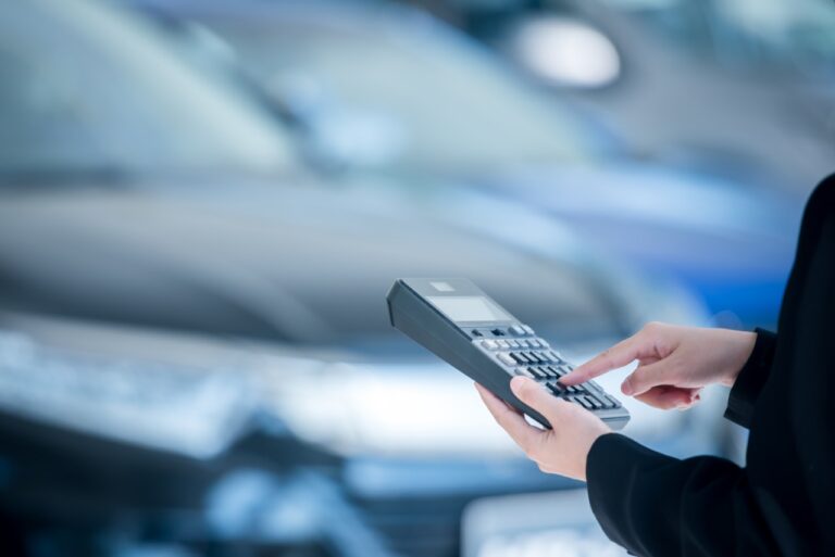 Dealership manager reviewing automated CSI data collection reports